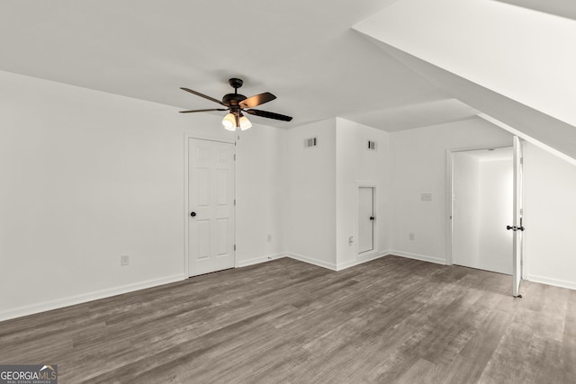 bonus room with wood finished floors, baseboards, a ceiling fan, and visible vents