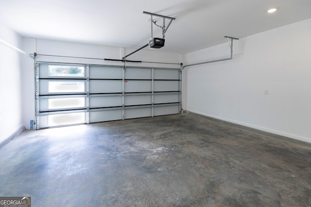 garage featuring recessed lighting, baseboards, and a garage door opener