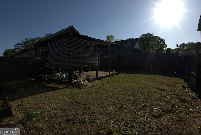 view of yard featuring a fenced backyard and a patio