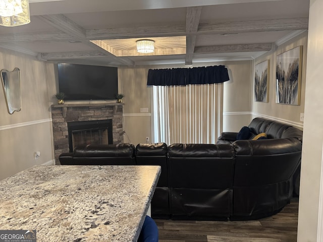 living room with coffered ceiling, crown molding, wood finished floors, and beamed ceiling