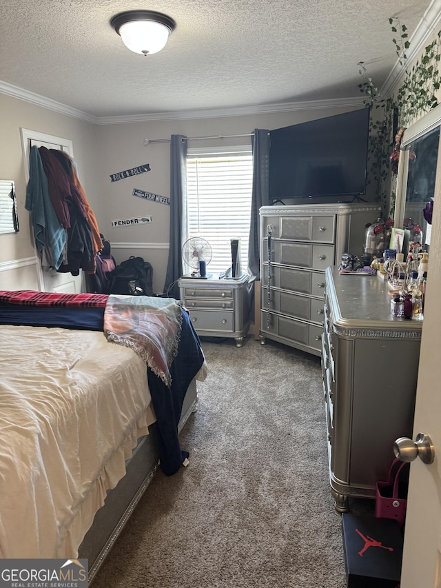 bedroom with crown molding and a textured ceiling
