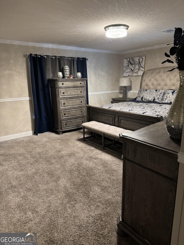bedroom with crown molding, visible vents, carpet, and a textured ceiling