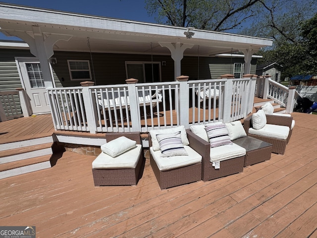 wooden deck featuring an outdoor hangout area