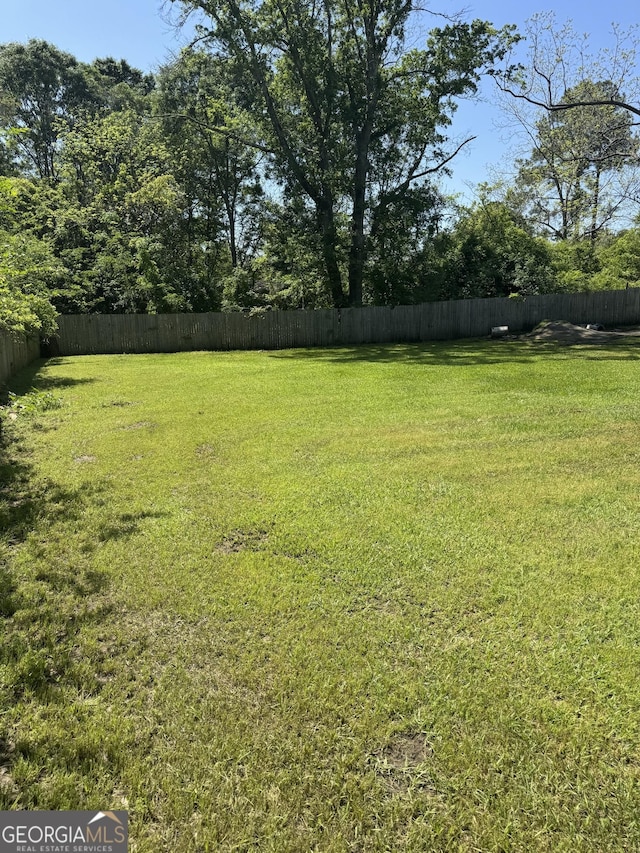 view of yard featuring fence private yard