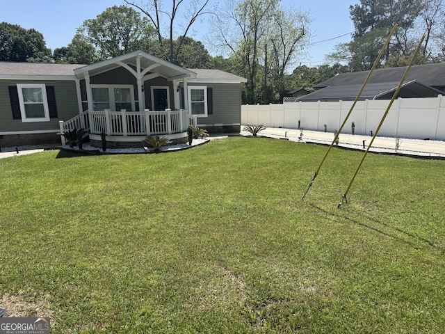 view of front of house featuring a front yard, fence, and crawl space
