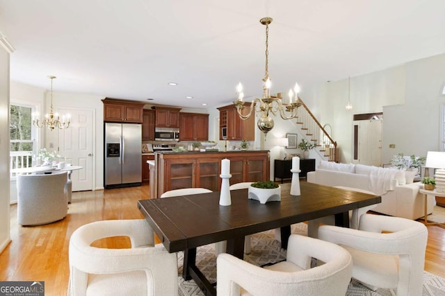 3711 Spinnaker Cir, Alpharetta, GA 30005 - dining area featuring a chandelier, stairs, light wood-style flooring, and recessed lighting