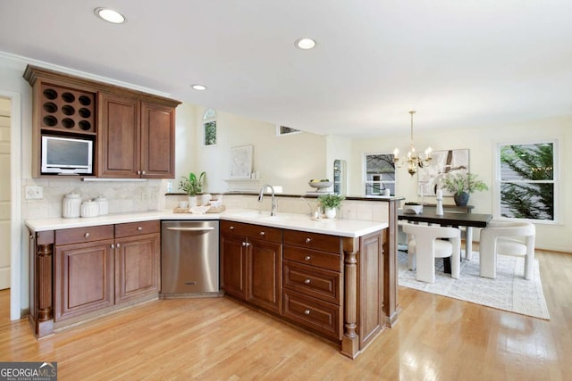 3711 Spinnaker Cir, Alpharetta, GA 30005 - kitchen featuring dishwasher, a peninsula, light wood finished floors, light countertops, and recessed lighting