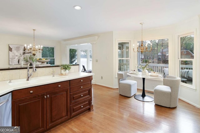 3711 Spinnaker Cir, Alpharetta, GA 30005 - kitchen with a chandelier, a sink, dishwasher, light wood finished floors, and recessed lighting