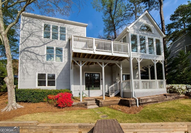3711 Spinnaker Cir, Alpharetta, GA 30005 - rear view of property with a wooden deck, a yard, and a sunroom