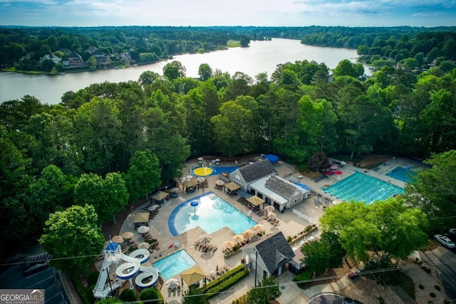 3711 Spinnaker Cir, Alpharetta, GA 30005 - drone / aerial view of a pool area, a nearby body of water, and a heavily wooded area