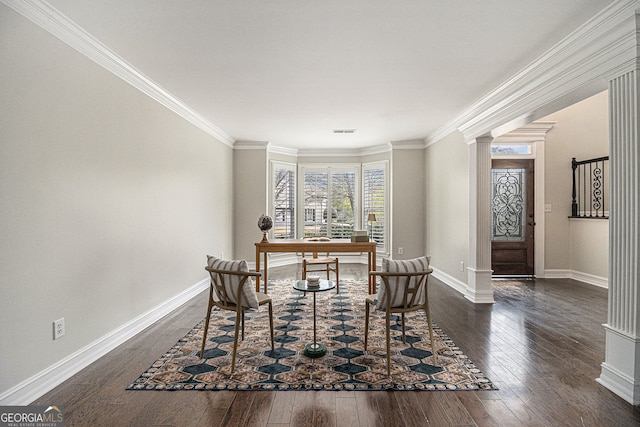dining area with dark wood-type flooring, visible vents, baseboards, and ornamental molding