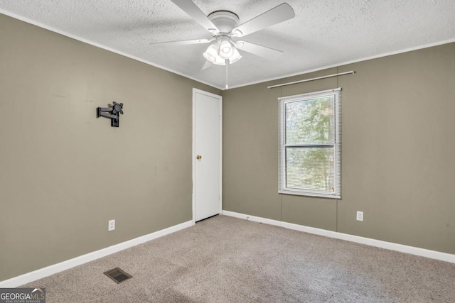 188 Paramount Dr, Eatonton, GA 31024 - carpeted empty room with visible vents, baseboards, a ceiling fan, and a textured ceiling