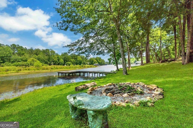 188 Paramount Dr, Eatonton, GA 31024 - dock area featuring a view of trees, a yard, and a water view