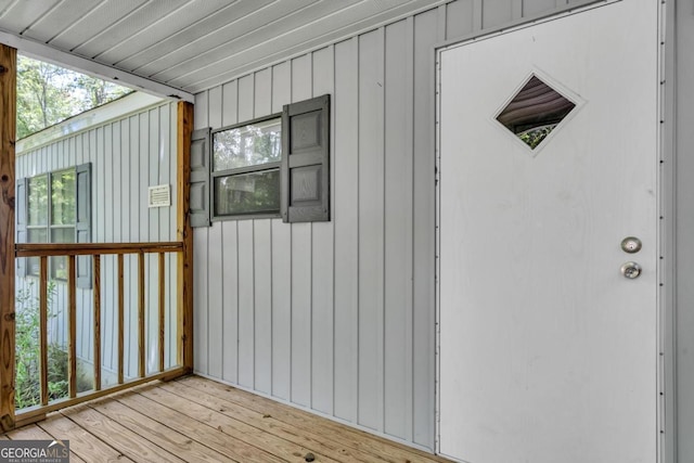188 Paramount Dr, Eatonton, GA 31024 - view of exterior entry featuring board and batten siding and a deck