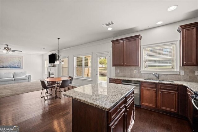 4735 Belcrest Way, Cumming, GA 30040 - kitchen with stainless steel dishwasher, open floor plan, a sink, and dark wood finished floors