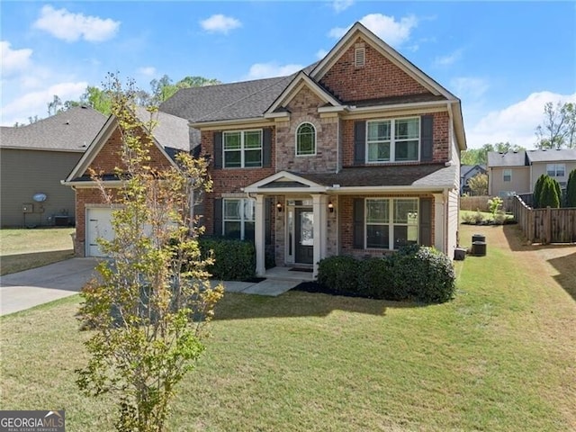 4735 Belcrest Way, Cumming, GA 30040 - view of front of home featuring concrete driveway, a front yard, brick siding, and a garage