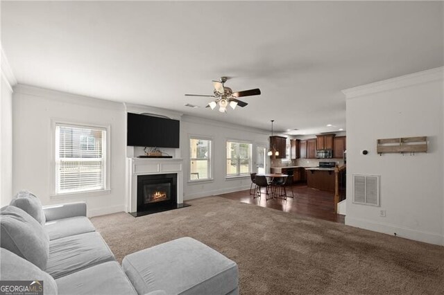 4735 Belcrest Way, Cumming, GA 30040 - carpeted living area with crown molding, ceiling fan, baseboards, and visible vents