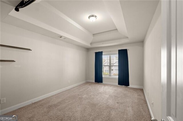 4735 Belcrest Way, Cumming, GA 30040 - unfurnished room with baseboards, a raised ceiling, and light colored carpet