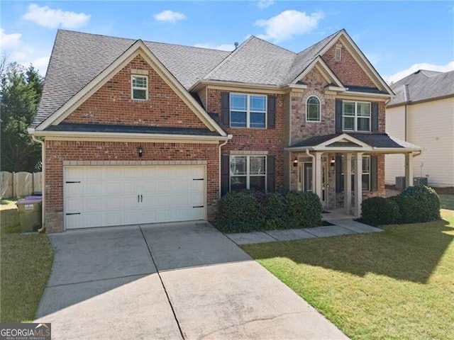 4735 Belcrest Way, Cumming, GA 30040 - view of front of house featuring a front yard, brick siding, and driveway