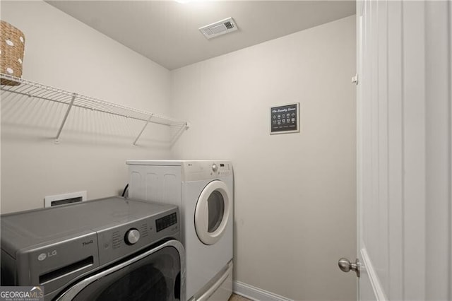 4735 Belcrest Way, Cumming, GA 30040 - washroom with washing machine and dryer, visible vents, laundry area, and baseboards