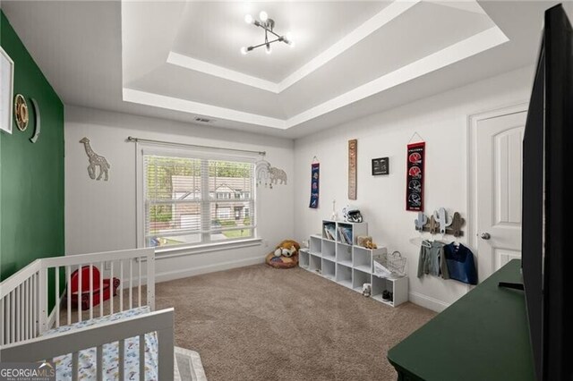 4735 Belcrest Way, Cumming, GA 30040 - carpeted bedroom with a tray ceiling, baseboards, and a nursery area