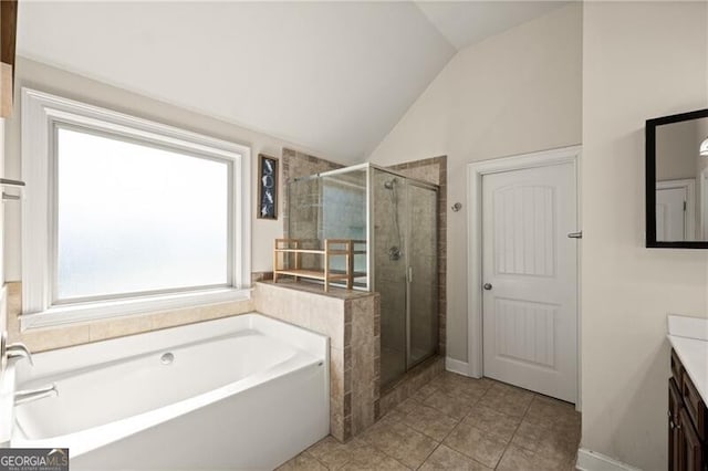 4735 Belcrest Way, Cumming, GA 30040 - full bath featuring a garden tub, vanity, lofted ceiling, a stall shower, and tile patterned floors