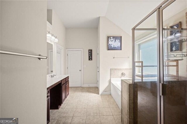 4735 Belcrest Way, Cumming, GA 30040 - bathroom with a bath, a shower stall, vanity, vaulted ceiling, and tile patterned flooring
