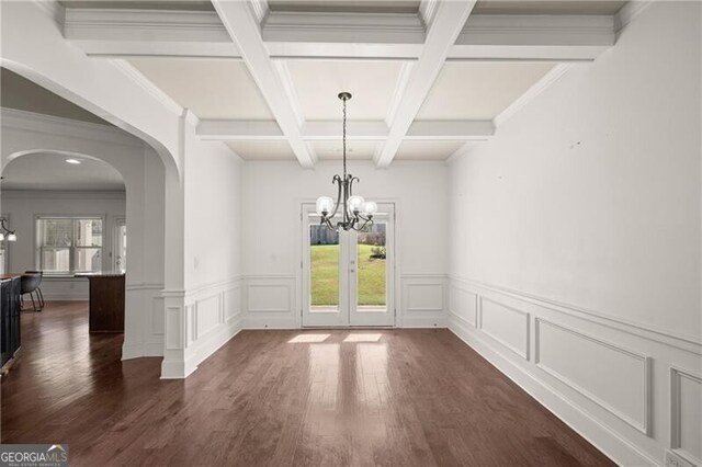 4735 Belcrest Way, Cumming, GA 30040 - unfurnished dining area with dark wood-style flooring, beam ceiling, arched walkways, and a notable chandelier