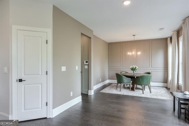 412 Nickajack Retreat Ln, Smyrna, GA 30082 - dining space with a decorative wall, dark wood finished floors, baseboards, a notable chandelier, and visible vents