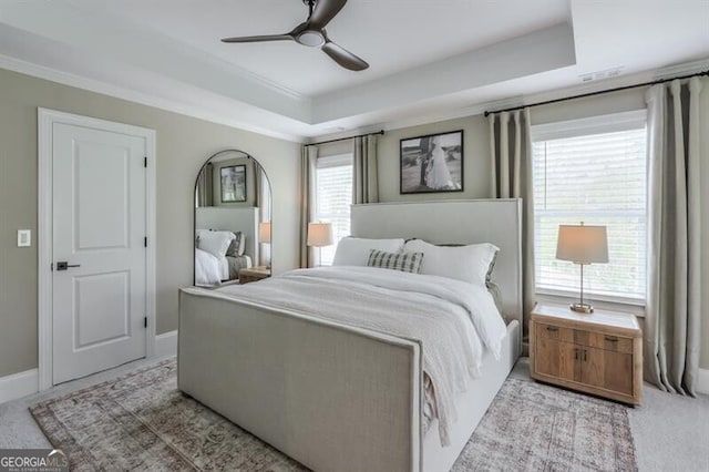 412 Nickajack Retreat Ln, Smyrna, GA 30082 - bedroom featuring light carpet, a raised ceiling, baseboards, ceiling fan, and ornamental molding