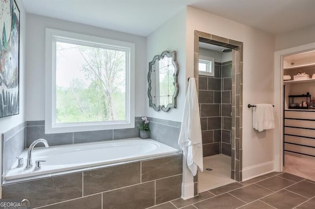 412 Nickajack Retreat Ln, Smyrna, GA 30082 - bathroom with a tile shower, a garden tub, and tile patterned flooring