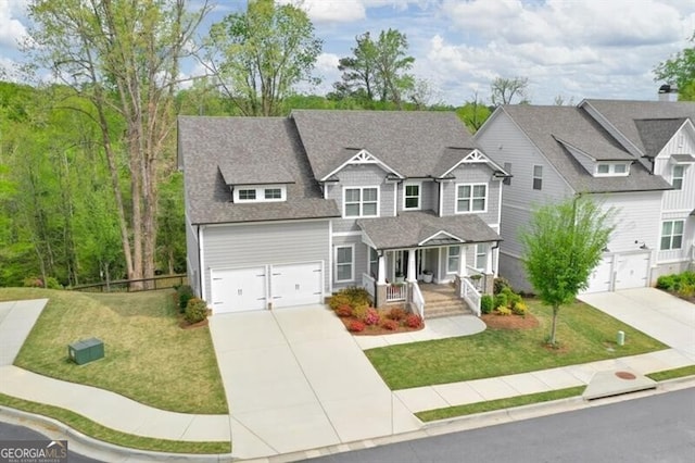 412 Nickajack Retreat Ln, Smyrna, GA 30082 - craftsman house featuring an attached garage, driveway, a porch, and a front yard