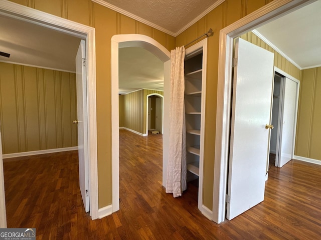 86 Empire St, Yatesville, GA 31097 - corridor featuring arched walkways, wood finished floors, ornamental molding, and a decorative wall