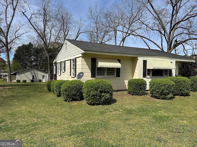 86 Empire St, Yatesville, GA 31097 - view of property exterior featuring a yard and a shingled roof