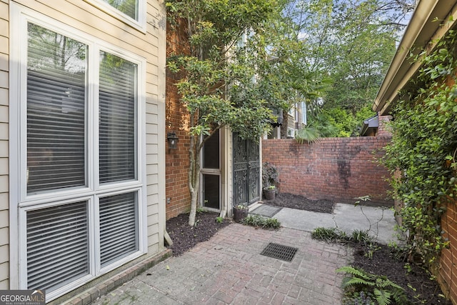 45 Willow Gln NE, Atlanta, GA 30342 - rear view of property with central air condition unit, a chimney, and brick siding