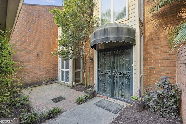 45 Willow Gln NE, Atlanta, GA 30342 - property entrance featuring brick siding and a patio area