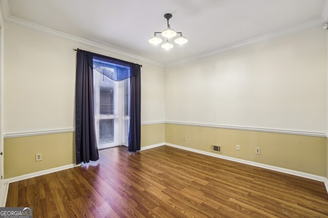 45 Willow Gln NE, Atlanta, GA 30342 - empty room featuring baseboards, an inviting chandelier, ornamental molding, visible vents, and wood finished floors