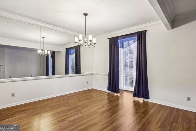 45 Willow Gln NE, Atlanta, GA 30342 - unfurnished dining area with a chandelier, wood finished floors, baseboards, and ornamental molding