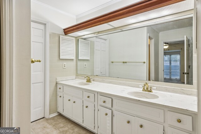 45 Willow Gln NE, Atlanta, GA 30342 - bathroom featuring a sink, tile walls, double vanity, and crown molding
