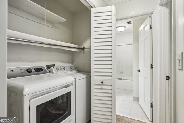 45 Willow Gln NE, Atlanta, GA 30342 - washroom featuring washer and dryer, light tile patterned floors, visible vents, and laundry area
