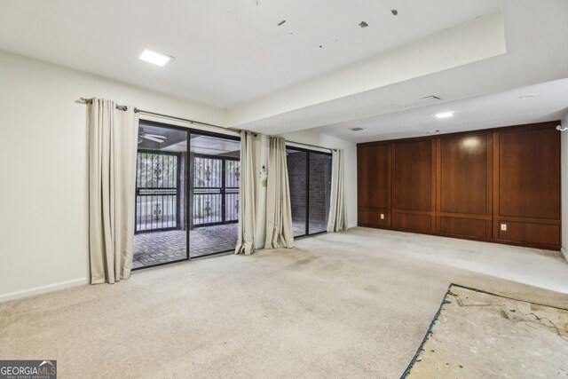 45 Willow Gln NE, Atlanta, GA 30342 - unfurnished living room featuring light colored carpet and baseboards