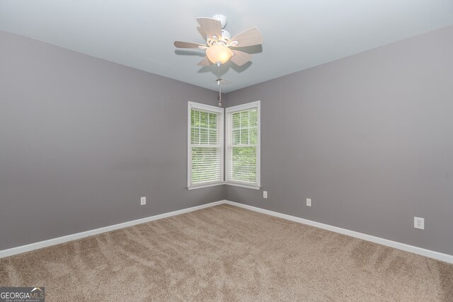 4106 Creekview Ridge Dr NE, Buford, GA 30518 - carpeted empty room with baseboards and ceiling fan