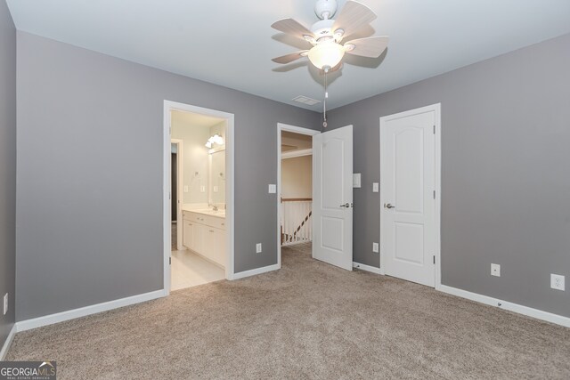 4106 Creekview Ridge Dr NE, Buford, GA 30518 - unfurnished bedroom with a ceiling fan, ensuite bathroom, baseboards, carpet flooring, and visible vents