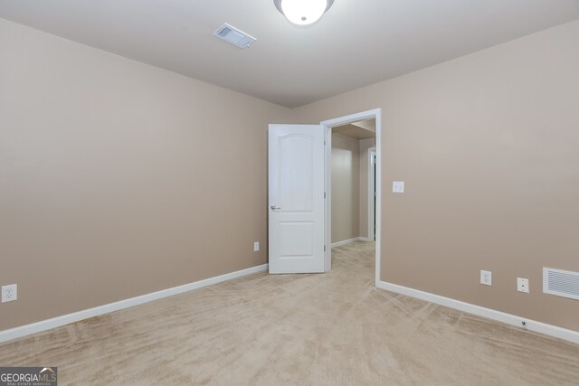 4106 Creekview Ridge Dr NE, Buford, GA 30518 - unfurnished room with a tray ceiling, light carpet, baseboards, and crown molding