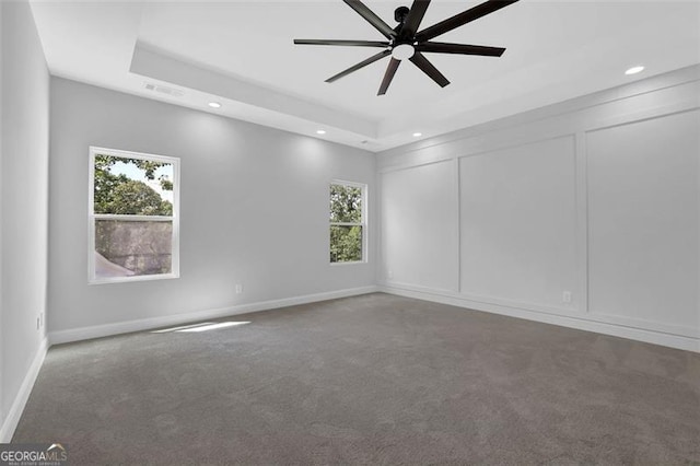 5719 Calm Valley Pt, Flowery Branch, GA 30542 - carpeted spare room featuring ceiling fan, recessed lighting, plenty of natural light, and a tray ceiling