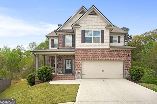 craftsman inspired home featuring covered porch, a front lawn, brick siding, a garage, and concrete driveway