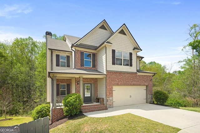 craftsman inspired home featuring concrete driveway, a chimney, an attached garage, brick siding, and covered porch