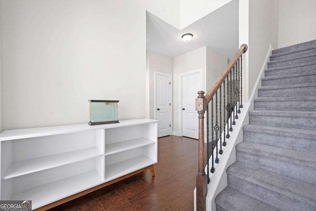 stairway featuring wood finished floors