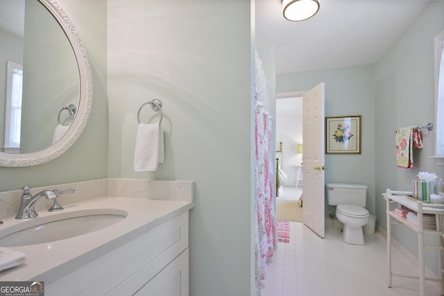 2000 Old Dominion Rd, Atlanta, GA 30350 - bathroom with toilet, tile patterned floors, and vanity