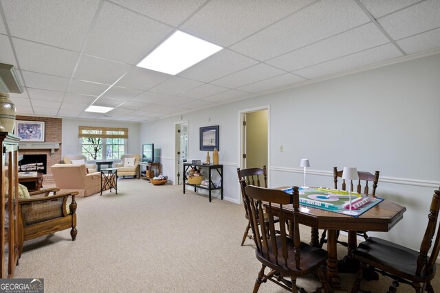 2000 Old Dominion Rd, Atlanta, GA 30350 - dining space with a paneled ceiling, carpet flooring, and a fireplace